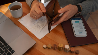 A piggy bank with coins, symbolizing saving money on a mortgage.